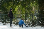 Two boys throwing snowballs
